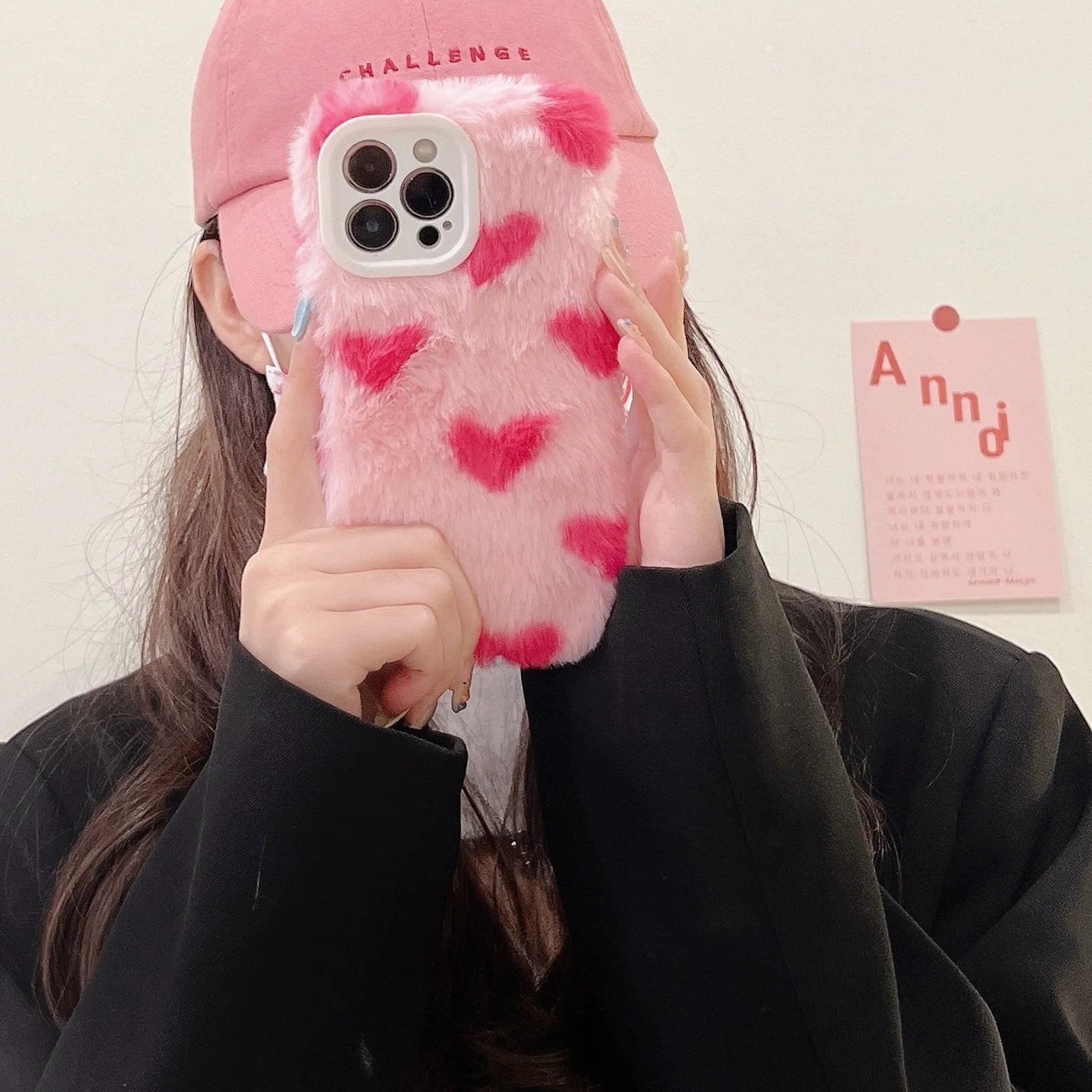 Pink silicone iPhone case with Love Plush cartoon design, shown as a back cover.