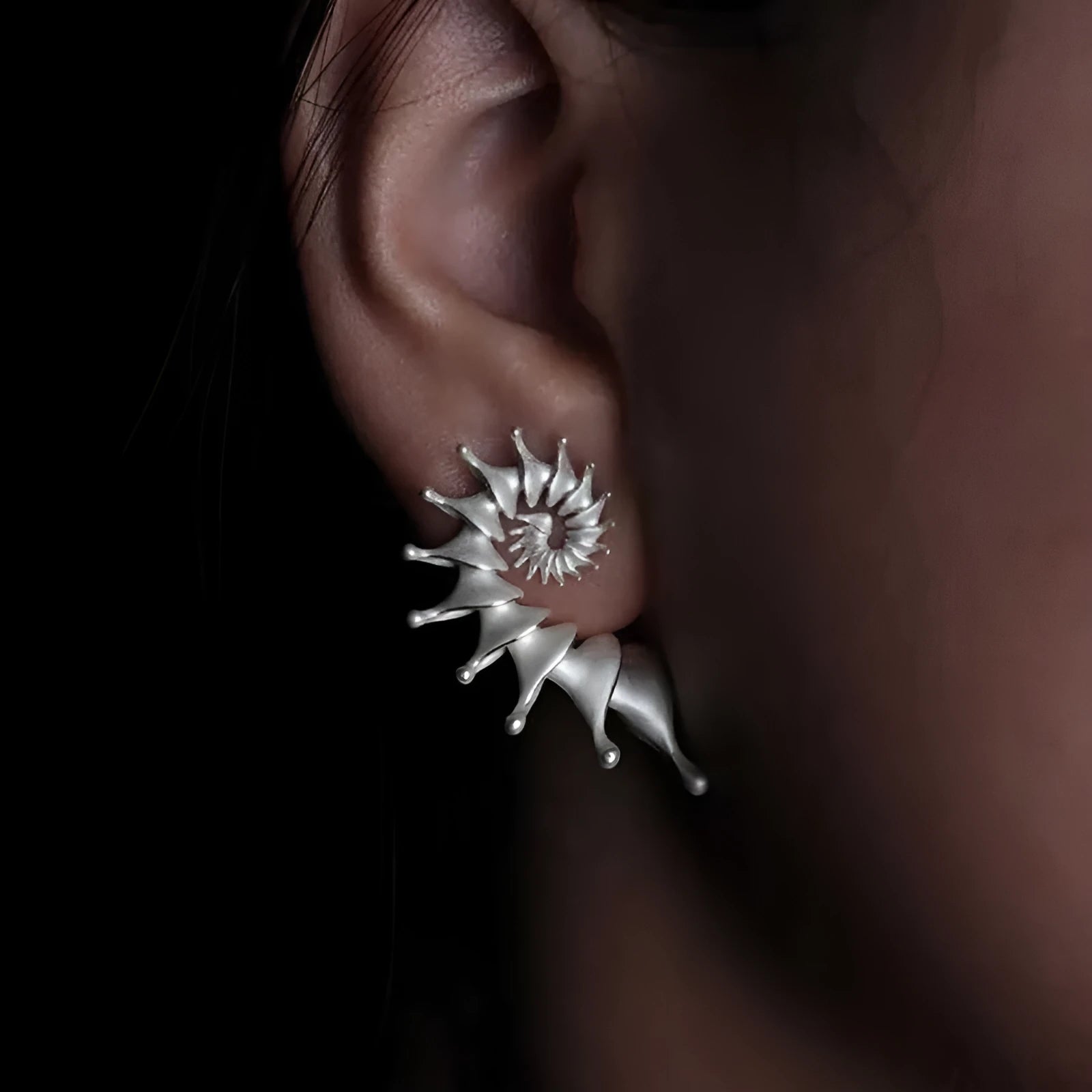 Three-dimensional matte finish conch shell stud earrings with exaggerated silhouette and simple styling