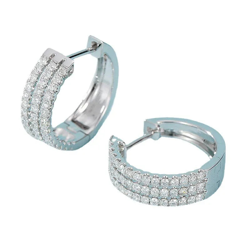 18K white gold natural diamond earrings with 56 point diamond in platinum finish on light background