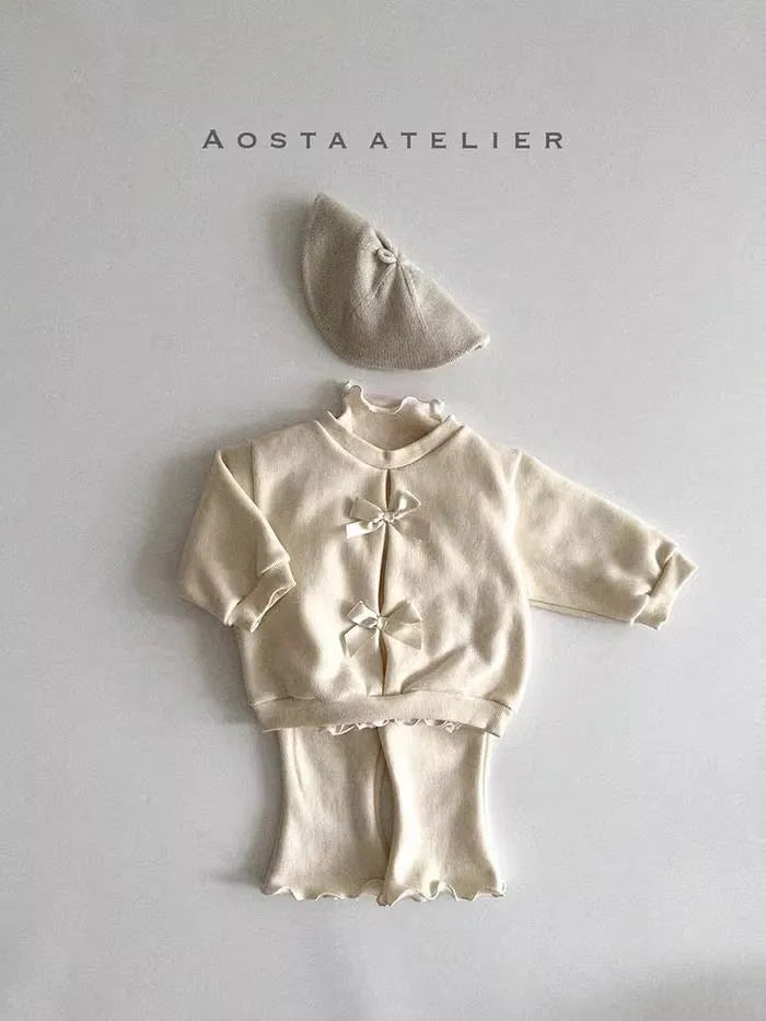 Girls cotton top and pants set in solid colour with wooden ear detail and matching hat