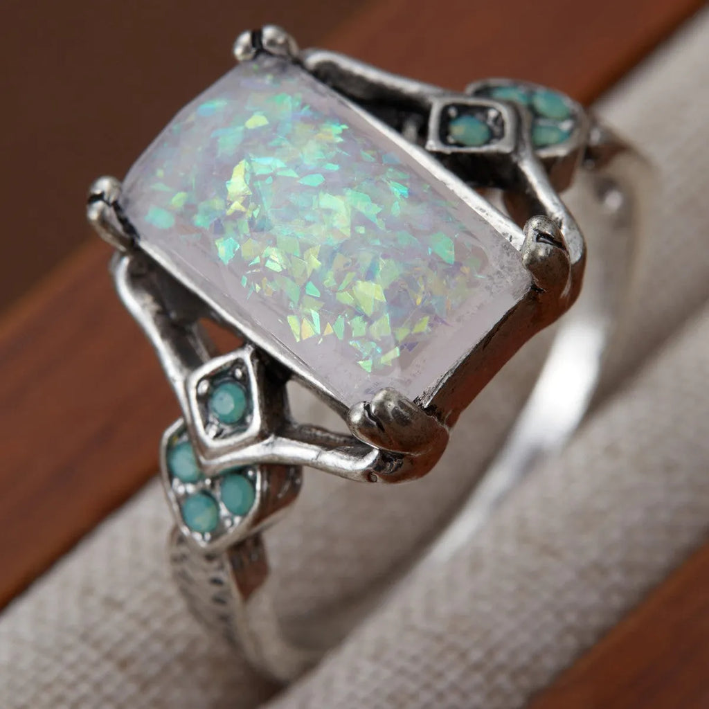 Rectangular white opal ancient silver ring on finger, silver tone, geometric design, alloy