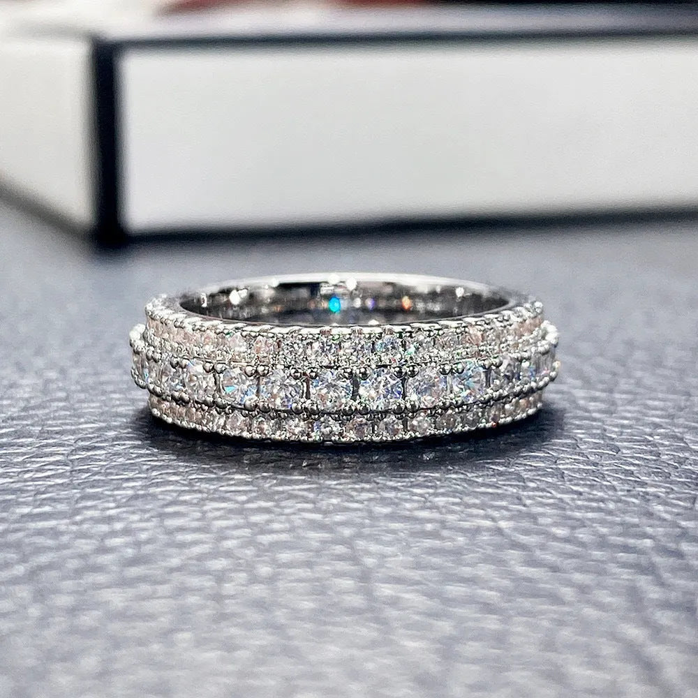 Personalised geometric triangle engagement ring with zircon inlay on a copper band.