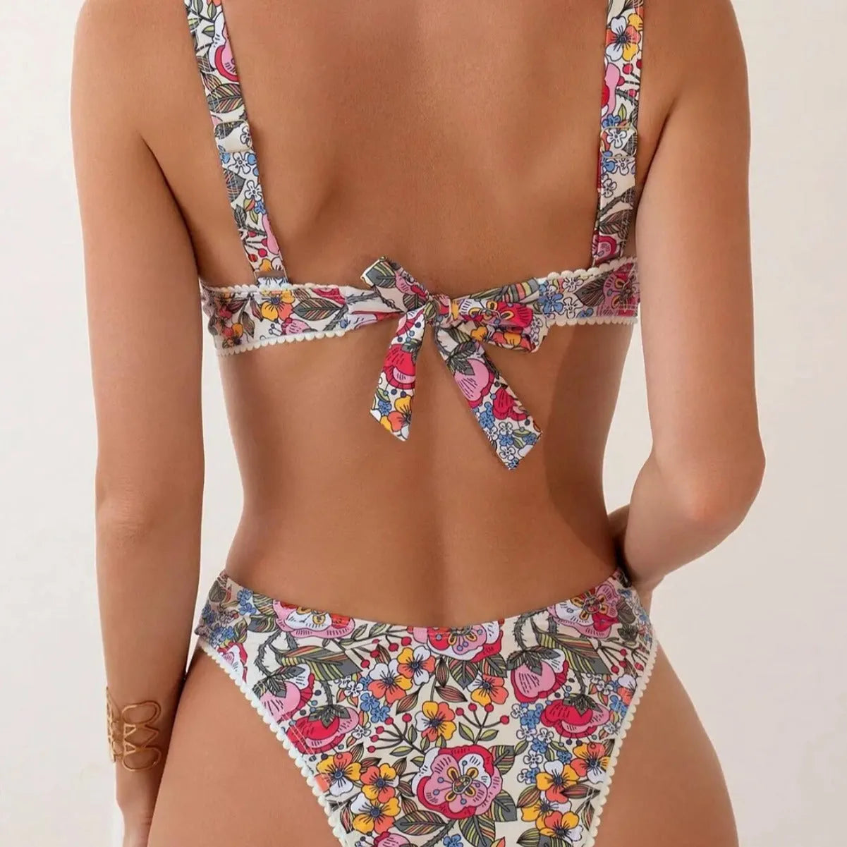 Women's floral print bikini with underwire bra and high-waisted briefs with side ties