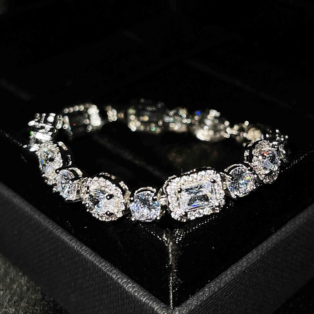 Women's geometric zircon bracelet with silver and white gold plating showing chain length options