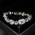 Women's geometric zircon bracelet with silver and white gold plating showing chain length options