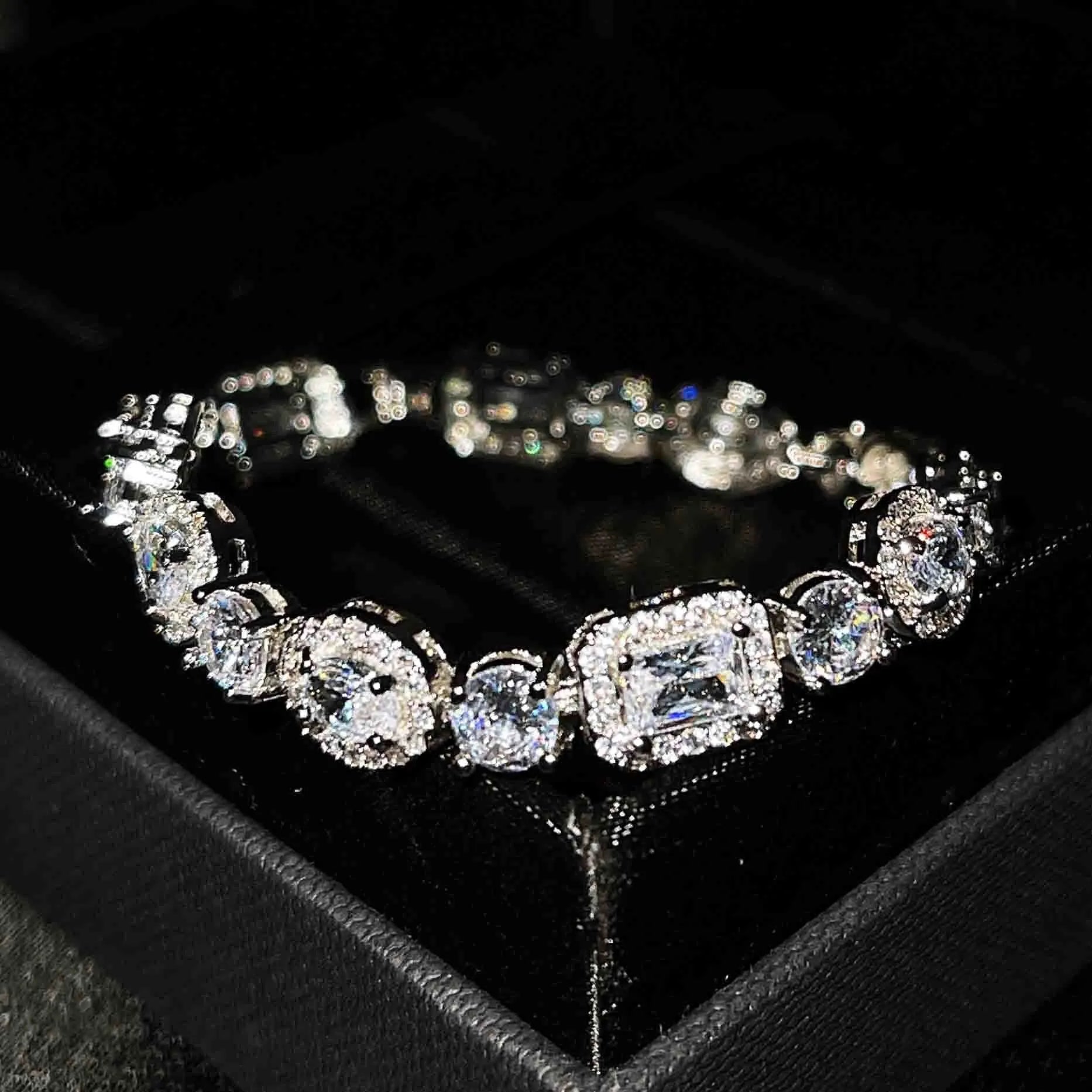 Women's geometric zircon bracelet with silver and white gold plating showing chain length options