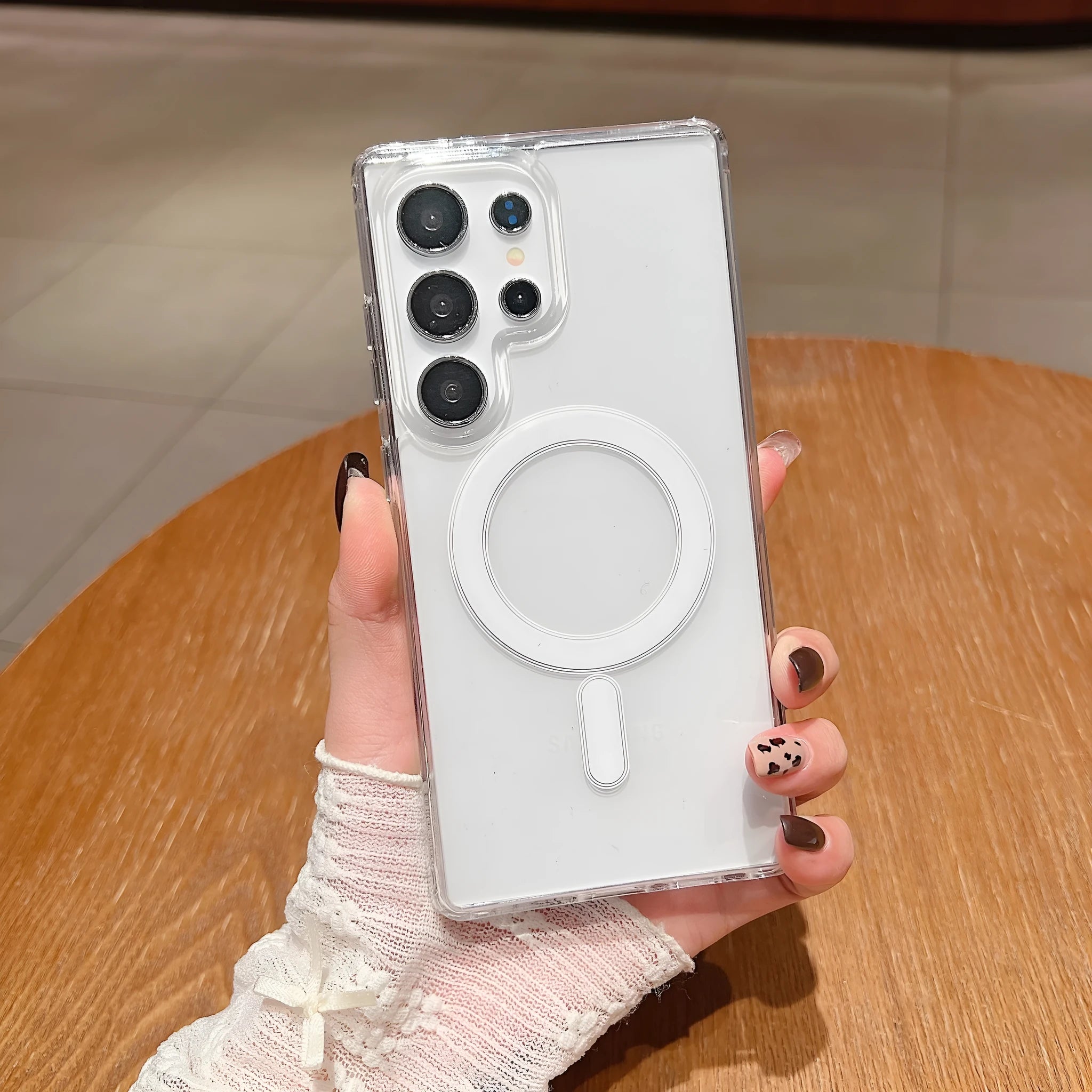 Clear magnetic silicone phone case on a Samsung smartphone showing transparent design and all-inclusive coverage.