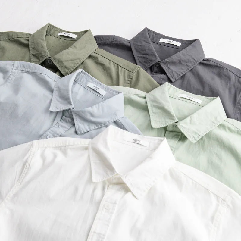 Men's loose-fit pure cotton short sleeve shirt in light blue, showing casual cardigan style.