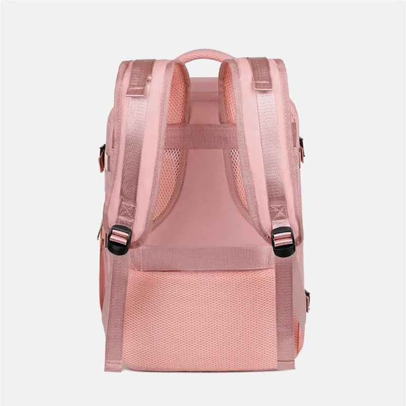 Large grey travel backpack for women with multiple compartments, shown open.