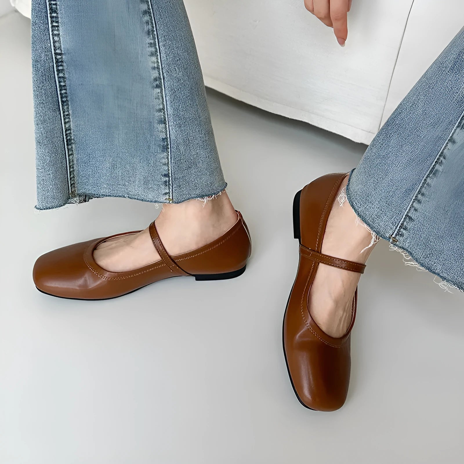 Women's retro black sheepskin Mary Jane flat shoes with a round toe and ankle strap on a rubber sole.