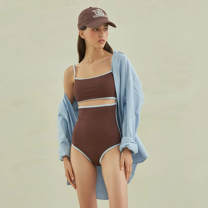 Brown triangle one-piece swimsuit for women on a mannequin.