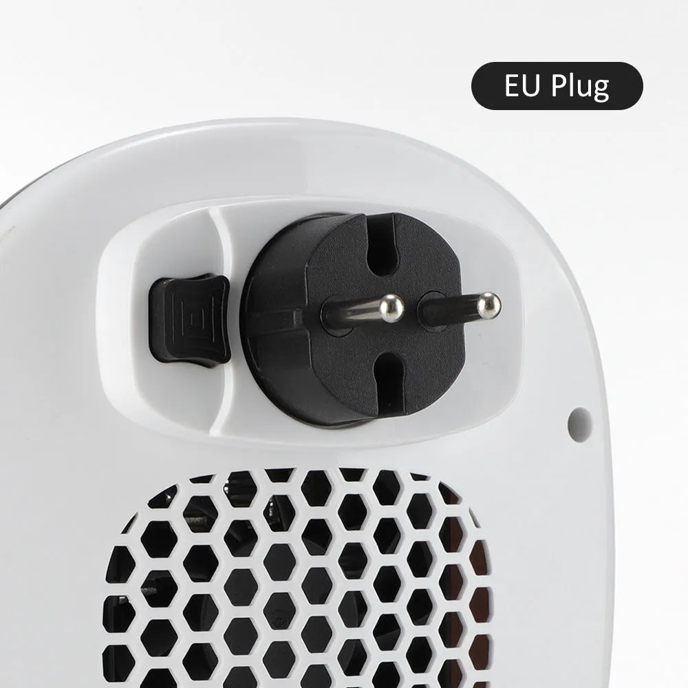 White portable ceramic electric heater with remote control on table