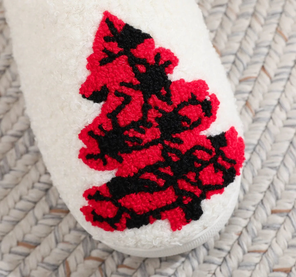 Pair of Christmas tree patterned slippers with plush upper and plastic non-slip sole