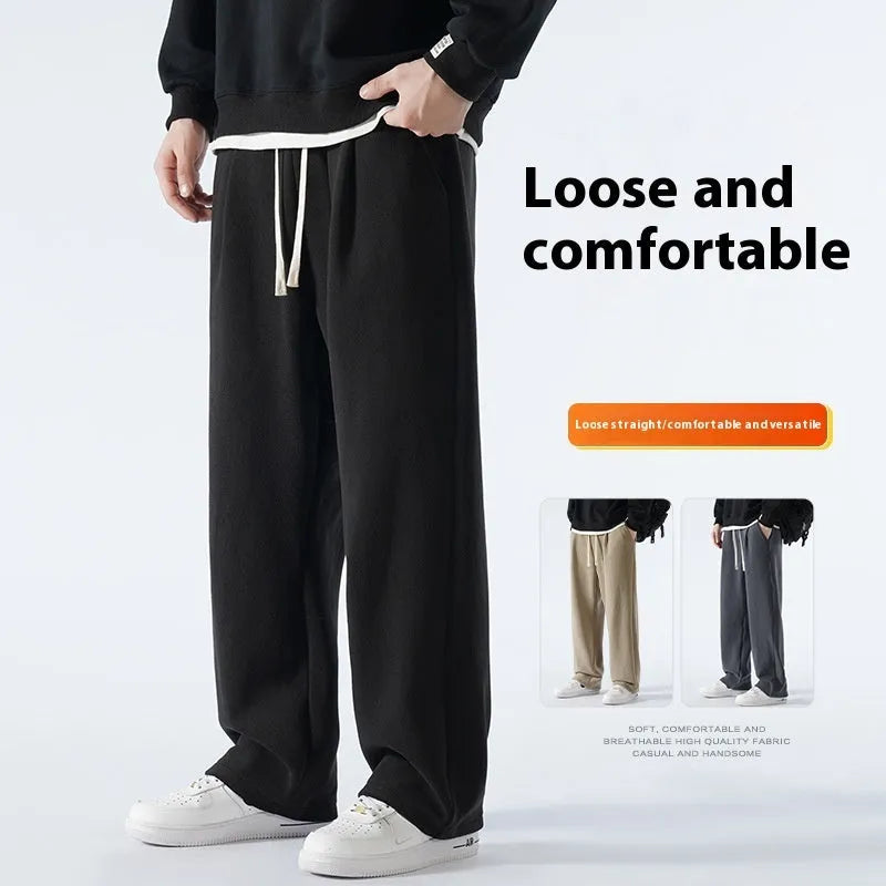 Man wearing apricot coloured loose-fit fleece-lined casual trousers with an elasticated waist.