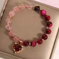 Women's simple strawberry crystal bracelet on an 18cm elastic band.