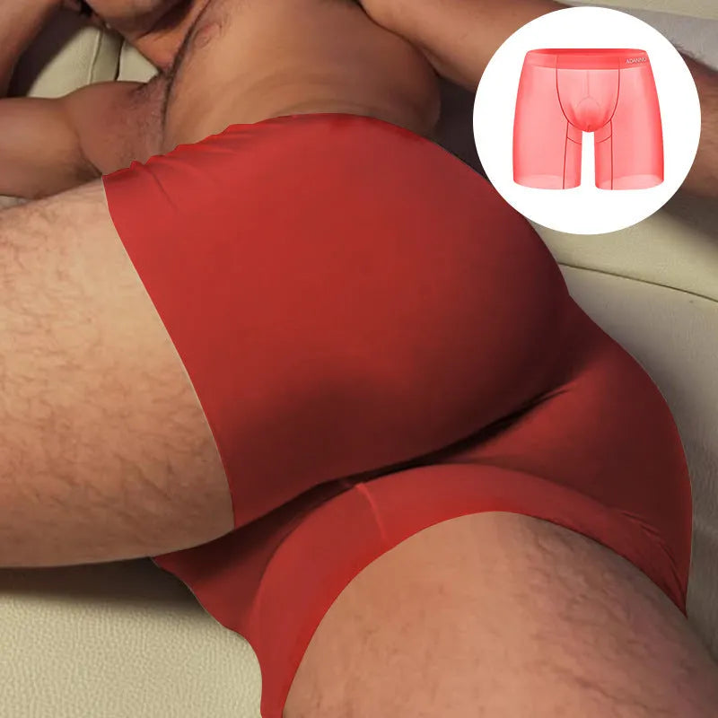 Seamless men's low-waist sports boxer shorts in orange nylon fabric, showing hip-lift design.