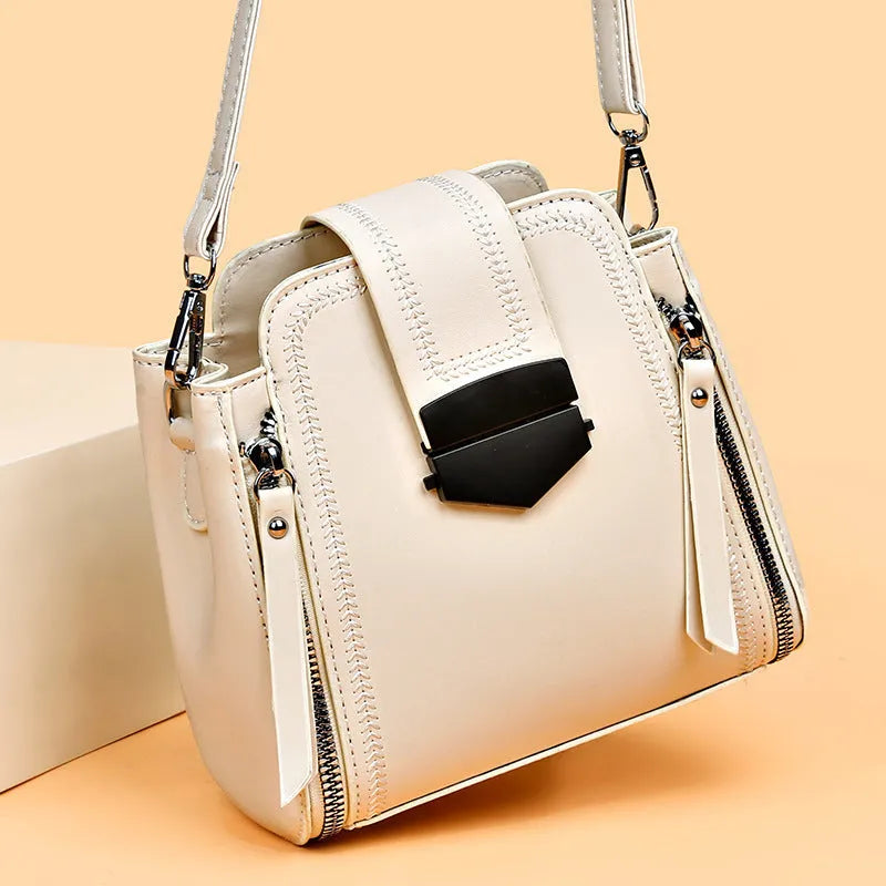 Square vertical PU leather handbag with textured finish and sewing thread detail in colour options