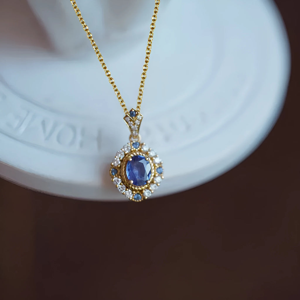 Yellow gold plated women's necklace with mixed gem pendant on an adjustable box chain.