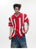 Man wearing a red and black patchwork striped retro knitted short-sleeved shirt in a loose fit.