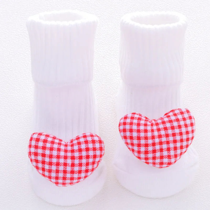 Cotton baby floor socks in multiple designs including panda, bow, and star patterns.