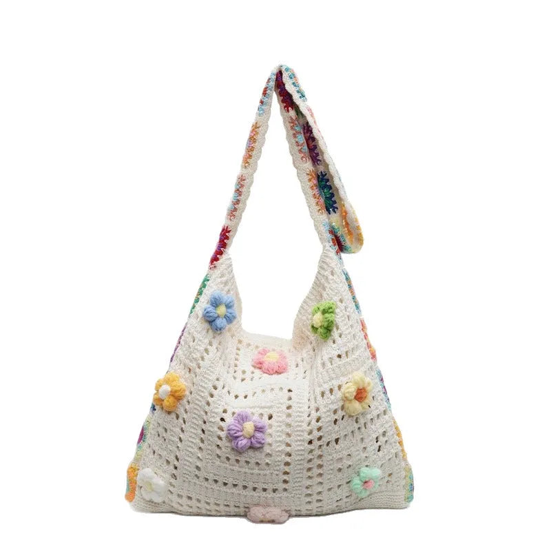Woven beach shoulder bag with hollow weave pattern showing adjustable strap and interior