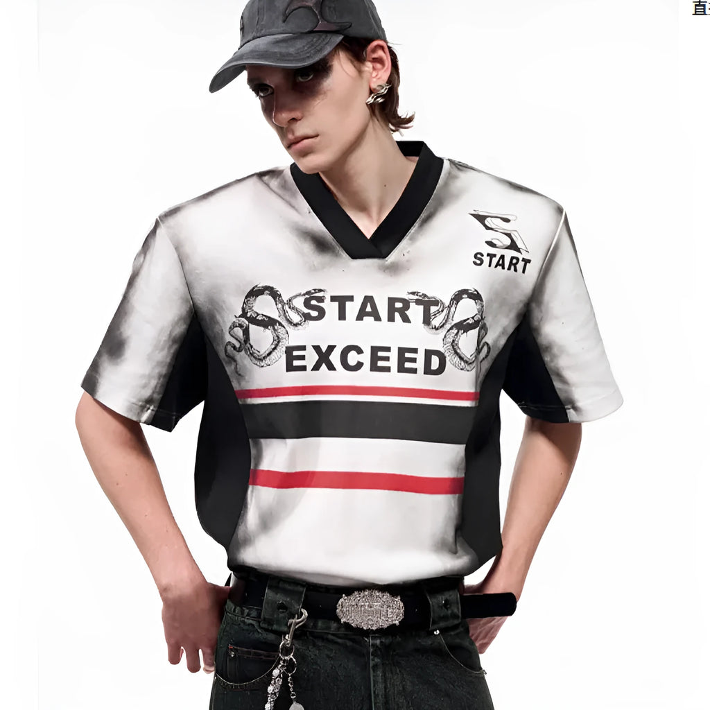 Women's short sleeve V-neck blouse with snake letter pattern print and padded shoulders.
