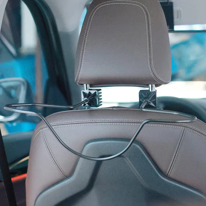 Black metal snap-on hat bracket for car interior display stand holding a hat