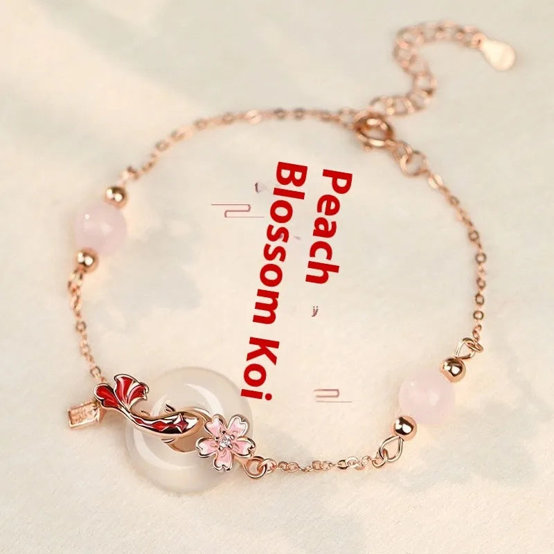 S925 sterling silver bracelet with white chalcedony crystals and a floral koi design.