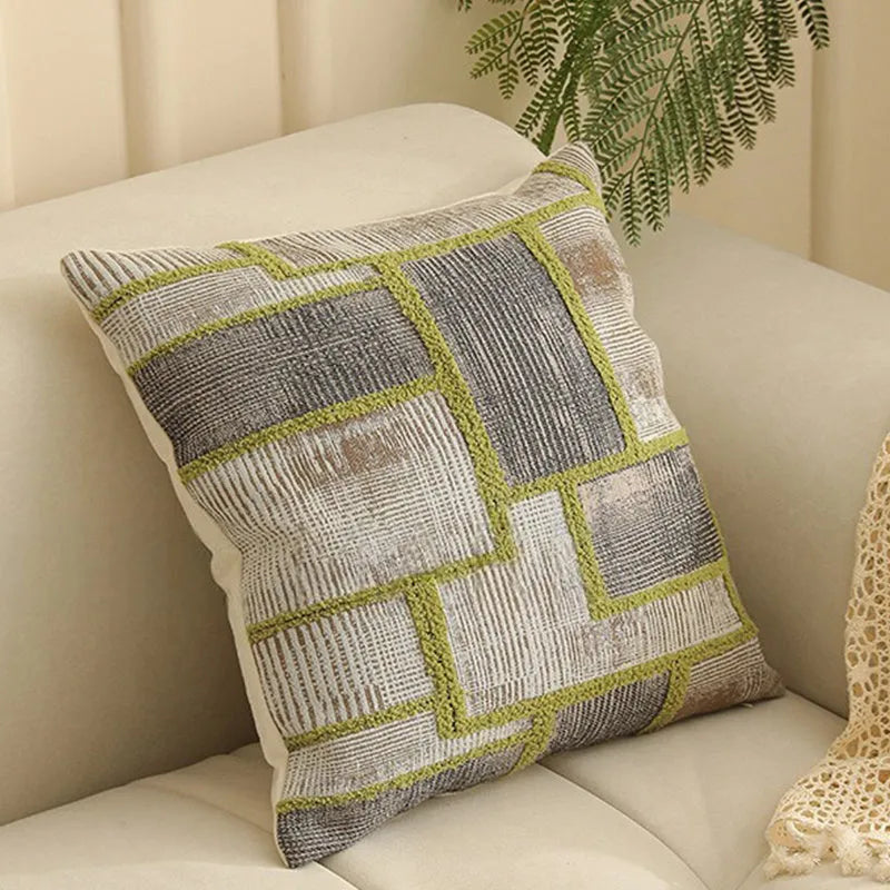 Close-up of a beige and green floral Jacquard woven cushion cover with textured pattern, 45cm square.