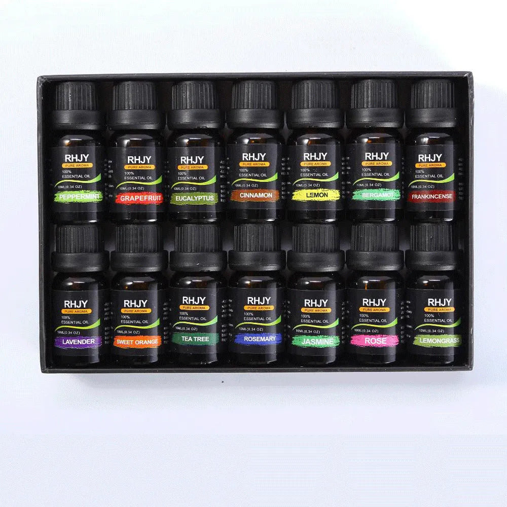 Essential oil set of 14 fragrances in 10ml bottles including rose, lavender, and lemon on a surface