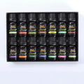 Essential oil set of 14 fragrances in 10ml bottles including rose, lavender, and lemon on a surface