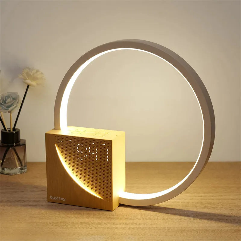 Navy blue touch control bedside lamp with digital alarm clock display and natural sounds functions.