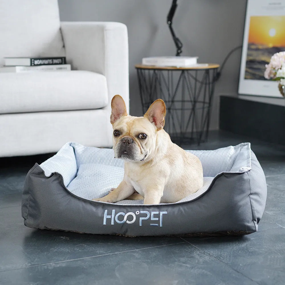 Soft grey dog bed with raised sides and a removable cover, shown in medium size.