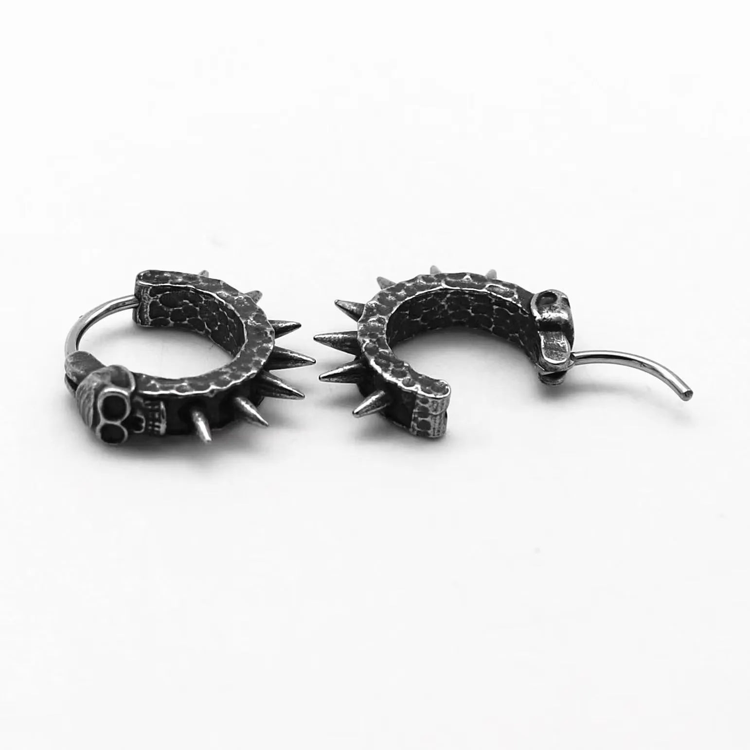 Black geometric motorcycle-shaped stud earrings made from alloy and plastic for punk style.