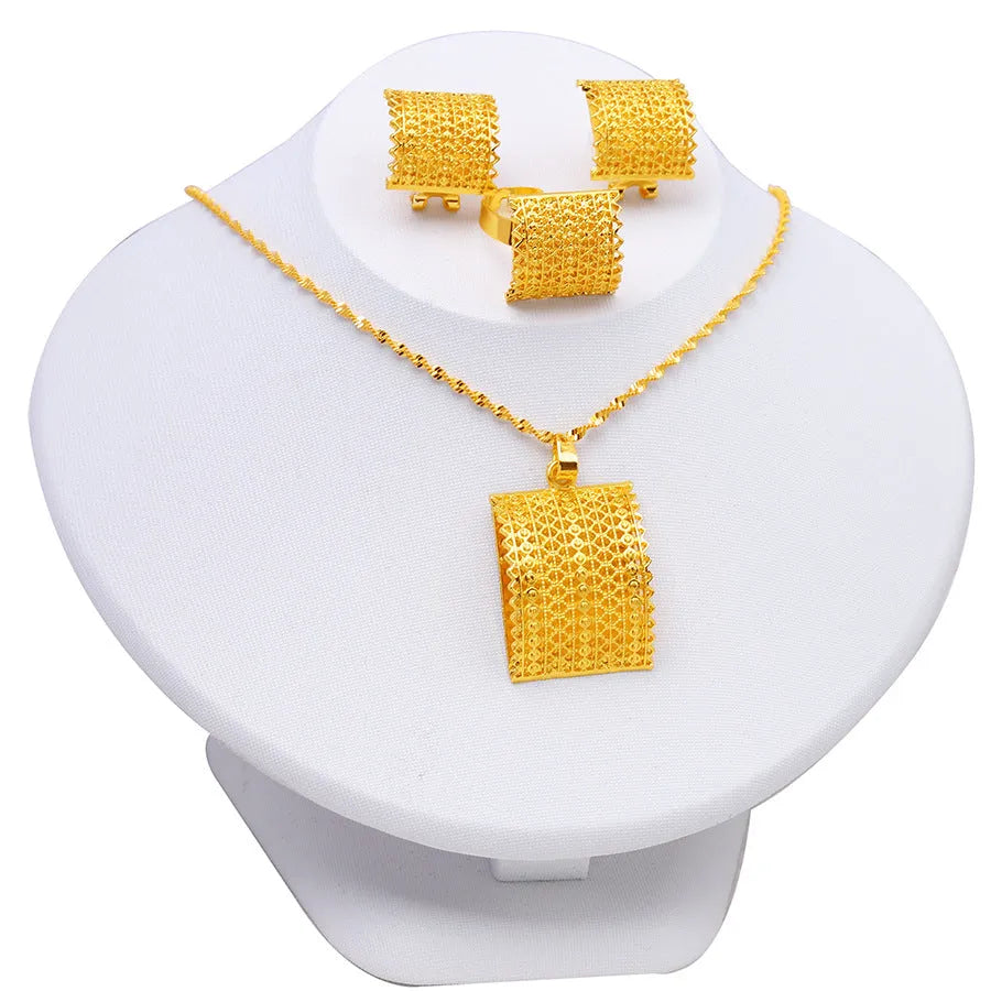 Golden copper bridal jewellery set featuring a necklace, pair of earrings, and a ring.