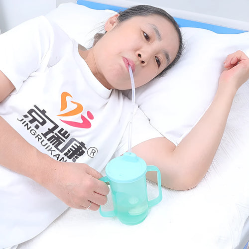 Oblique mouth anti-choke bed care cup with handle and optional wrist splint attachment