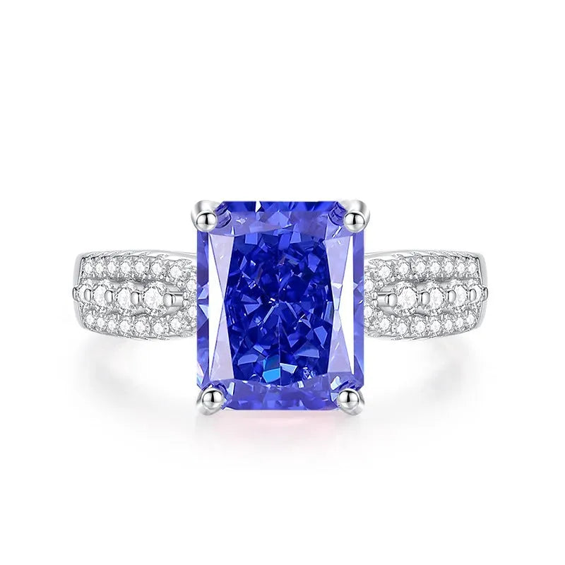 Heart-shaped sterling silver ring with a faceted colour zircon stone on a white background.