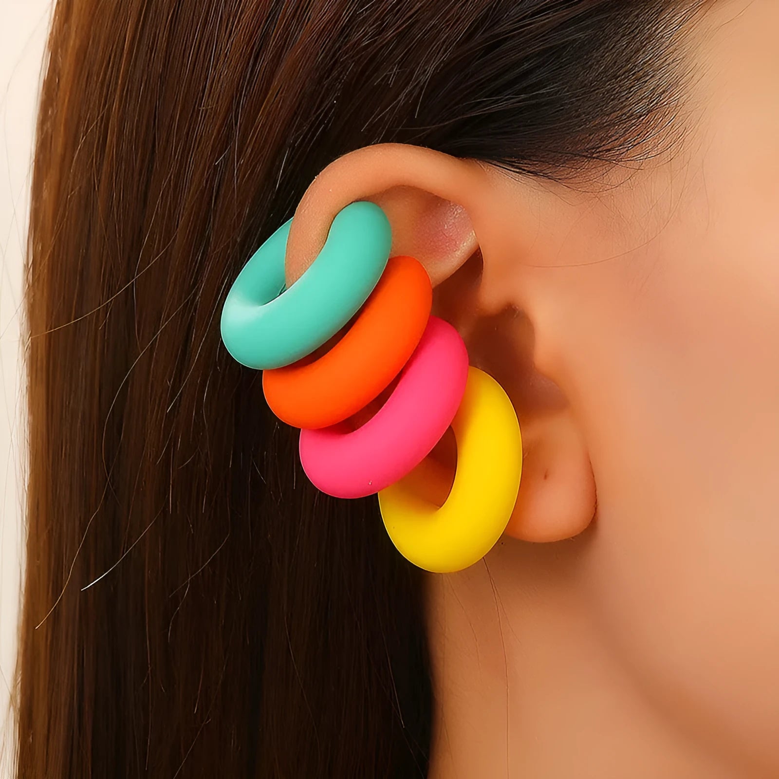 A pair of matte finish, coarse round C-shaped clip-on earrings for women in a choice of fifteen candy colours.