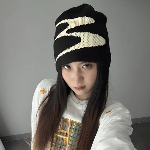Unisex acrylic knitted beanie hat in black, shown on a head model, size M for 56-58cm circumference.