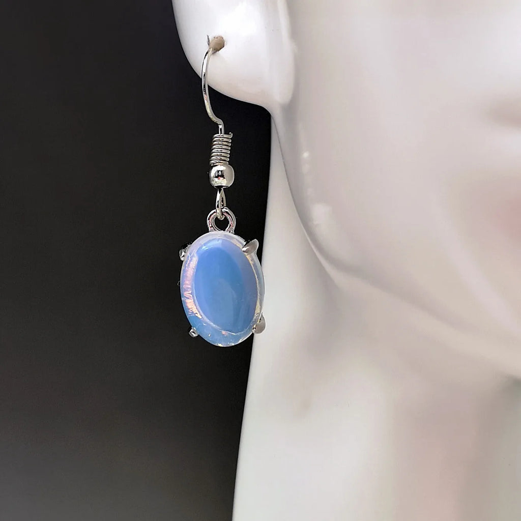 Moonlight white opal drop earrings with elliptical cross design on alloy electroplated setting