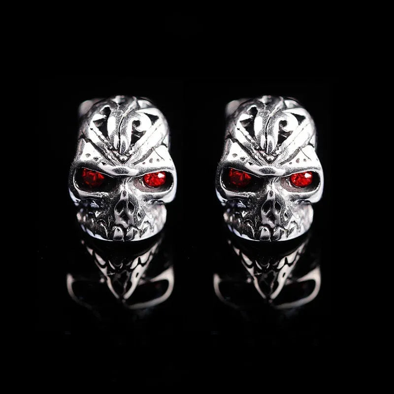 Retro skull stud earrings with ghost head design and red eye detail on alloy background