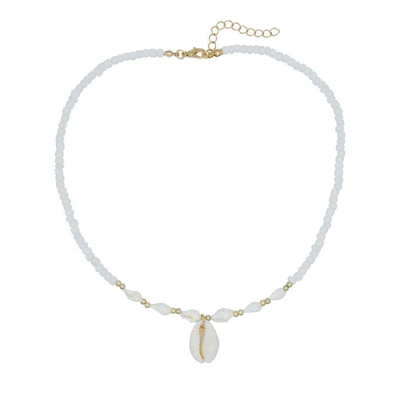 White bead necklace with a mother of pearl conch shell pendant on a regular chain.