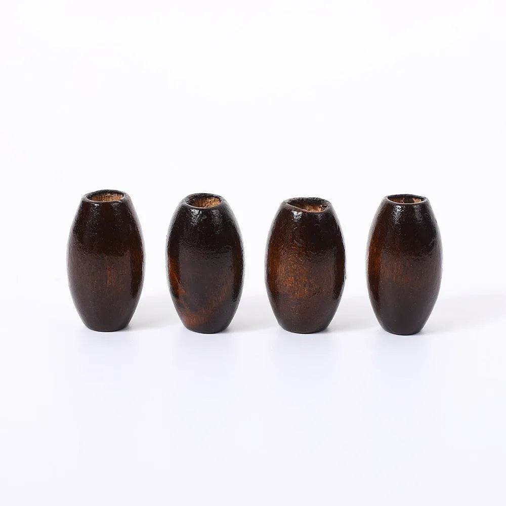 Dark coffee coloured oval M-shaped wooden bead measuring 25mm with a 6mm hole