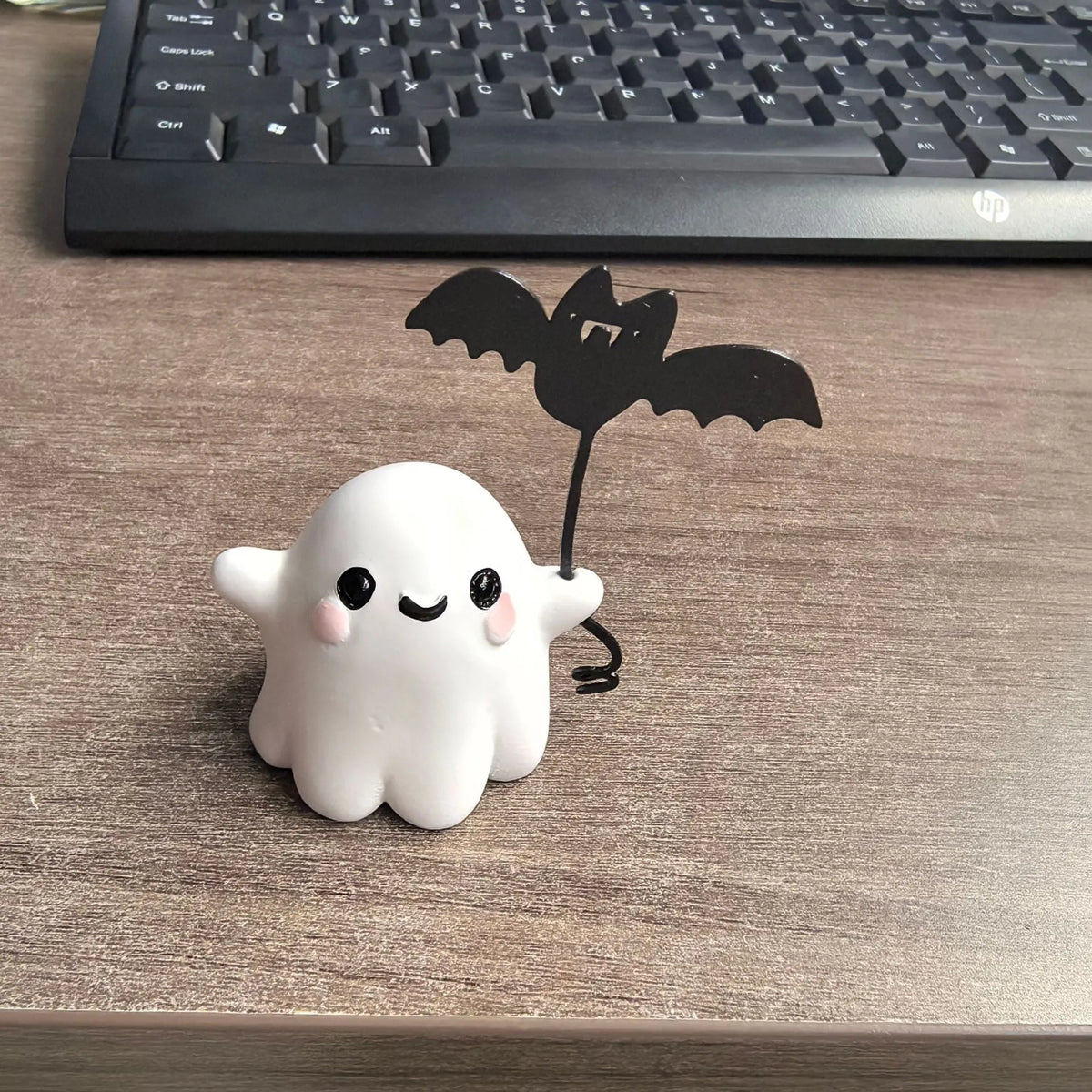 Mini resin Halloween ghost statue walking a dog and holding a bat, 4cm tall