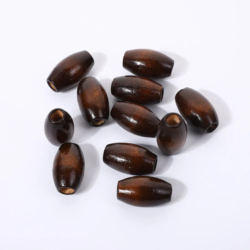 Dark coffee coloured oval M-shaped wooden bead measuring 25mm with a 6mm hole