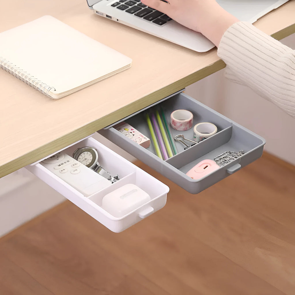 White plastic adhesive under-table storage drawer box with a grid-pattern lid