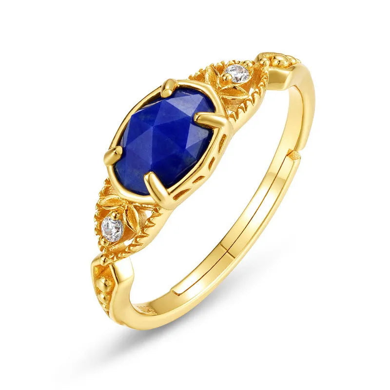 Geometric silver alloy ring with blue lapis lazuli stone centrepiece, elliptical Japanese style design.