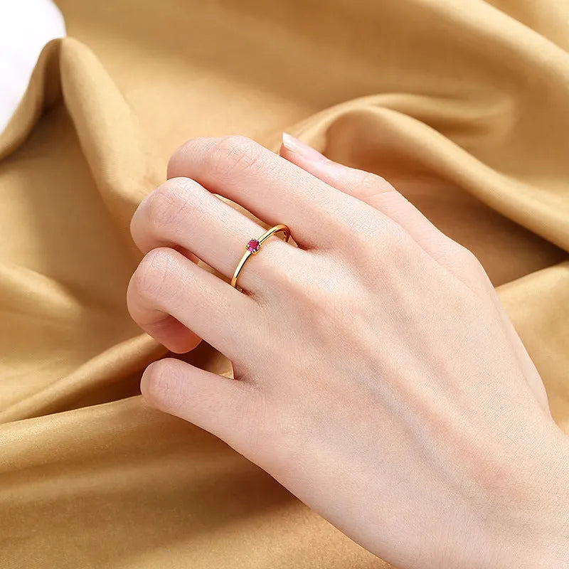 Women's geometric copper ring with single diamond in circle design showing colour options