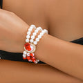 Halloween pearl collar necklace, stud earrings, and bracelet set in electroplated gold finishes.
