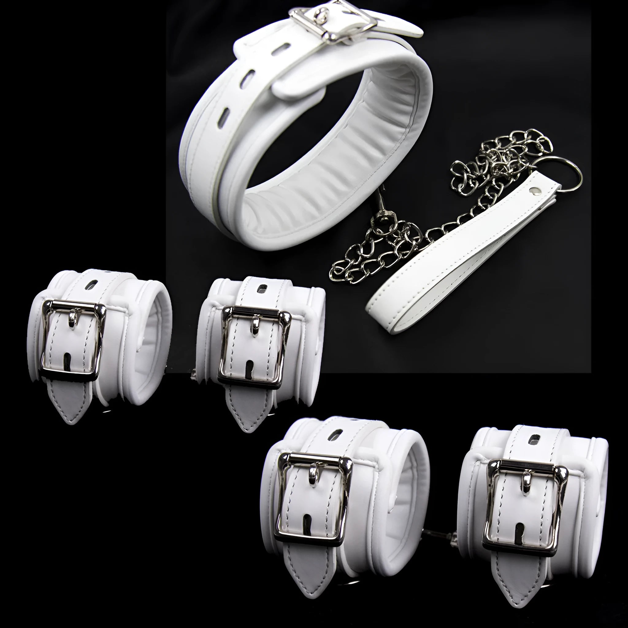 White PU sponge bondage sex toy set showing handcuffs, foot cuffs, and a neck scarf laid out.